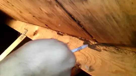 Another polyethylene sewer pipe emerging from ground exterior, adjacent to foundation