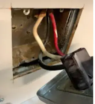Image of a damp ceiling around an extractor fan