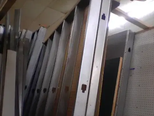 The filmsy metal bits between the walls