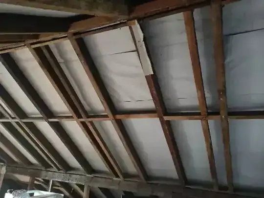 inside surface of roof showing additional timber parallel to rafters