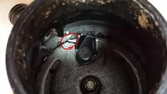 Metal piece wedged in garbage disposal