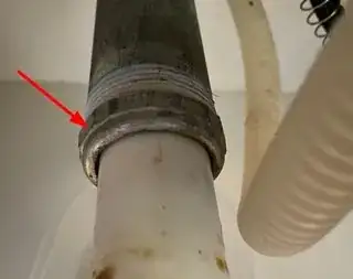metal stub pipe from wall indicating where the slip joint nut is