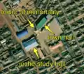 1/7 City centre that concentrates an immortality tower (historic=memorial), with its shadow cast on the ground, a juche study hall (amenity=community_centre), with its specific shape, and a city hall (amenity=townhall) (Maxar satellite imaging).