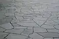 &nbsp;Crazy paving, combining a flat top with irregular shapes
