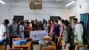 OSM Bangladesh - Group photo while cutting the cake for OpenStreetMap's 18th anniversary, at SUST (Shahjalal University of Science and Technology). Photo by Sawan Shariar on 2022-08-06.