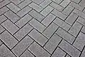 Small rectangular paving stones, sometimes called "bricks"