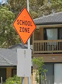 A school zone in Australia(traffic_sign=hazard + hazard=school_zone)