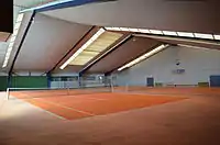 Indoor tennis courtleisure=pitchsport=tennissurface=carpetindoor=yes(each court one pitch)