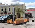 Parklet with seatings and plants.